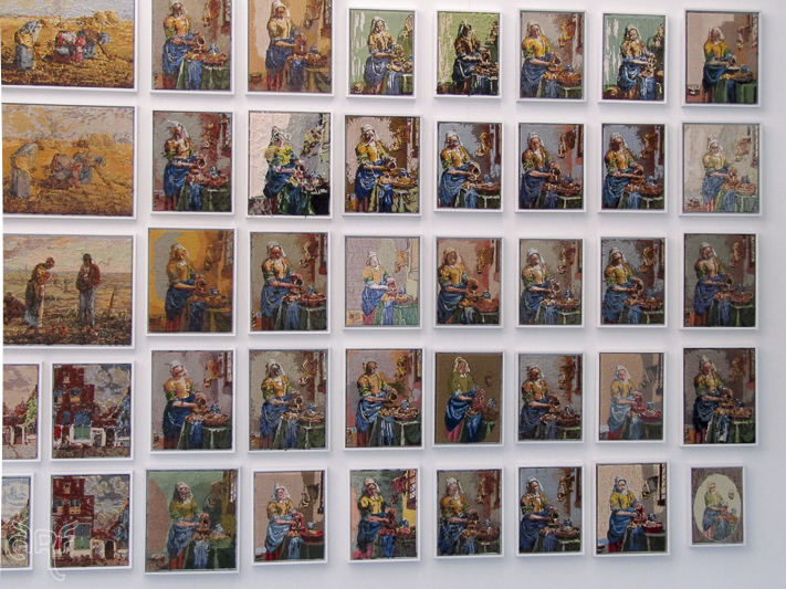 wall covered in Vermeer embroidery works