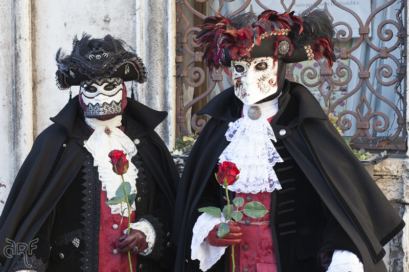Venice: two men in red and black costume
