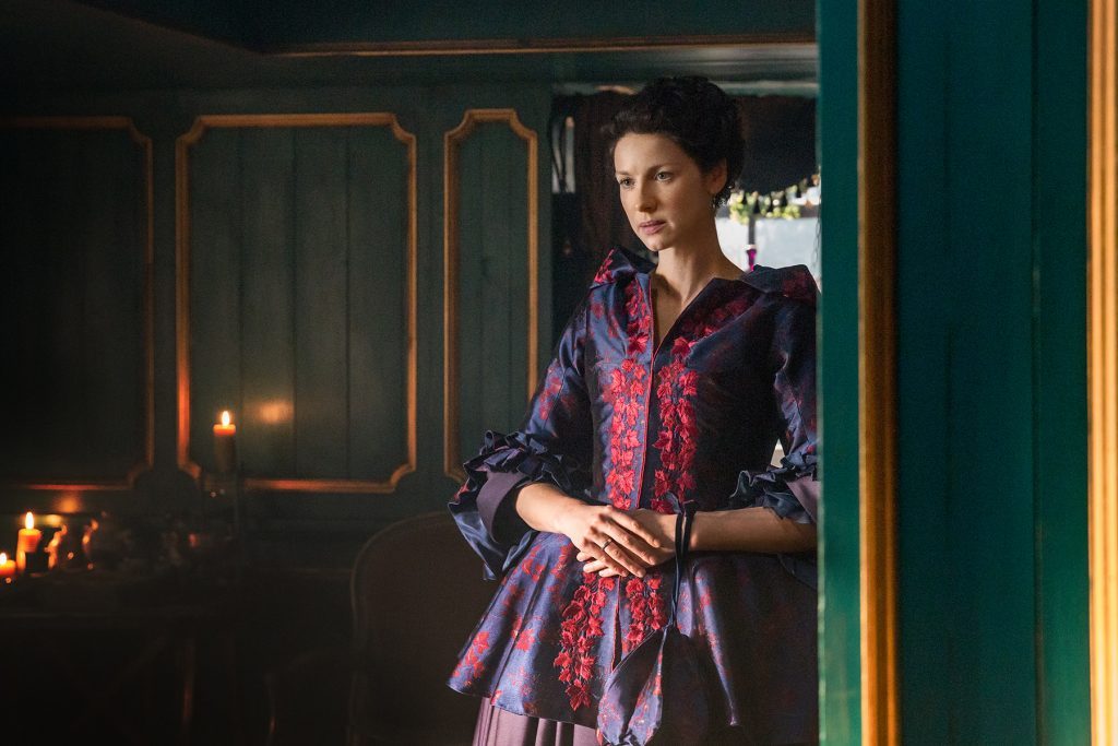 Claire Fraser in purple jacket
