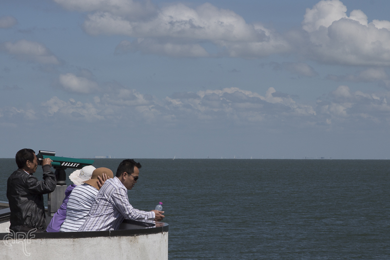 tourists at the Afsluitdijk gazing over the Waddenzee