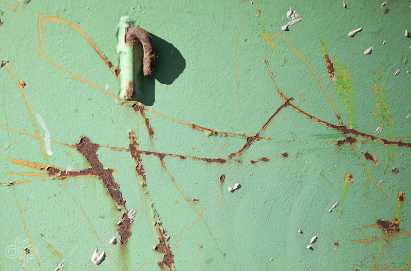 green container with rust