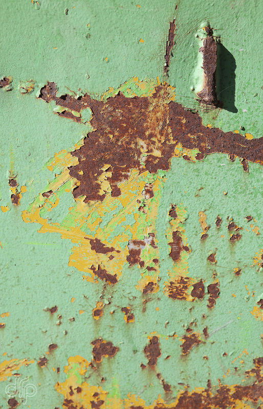 green container with rust and scratches