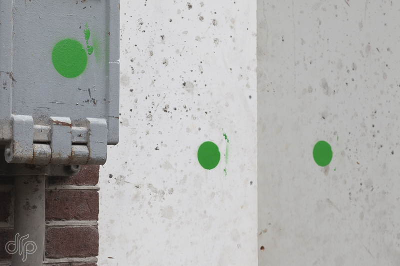 three painted dots in a row