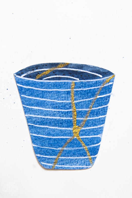 small indigo cup with gold
