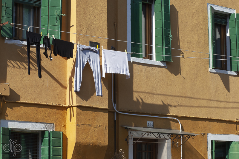 black and white laundry at ochre house in Burano, Italy