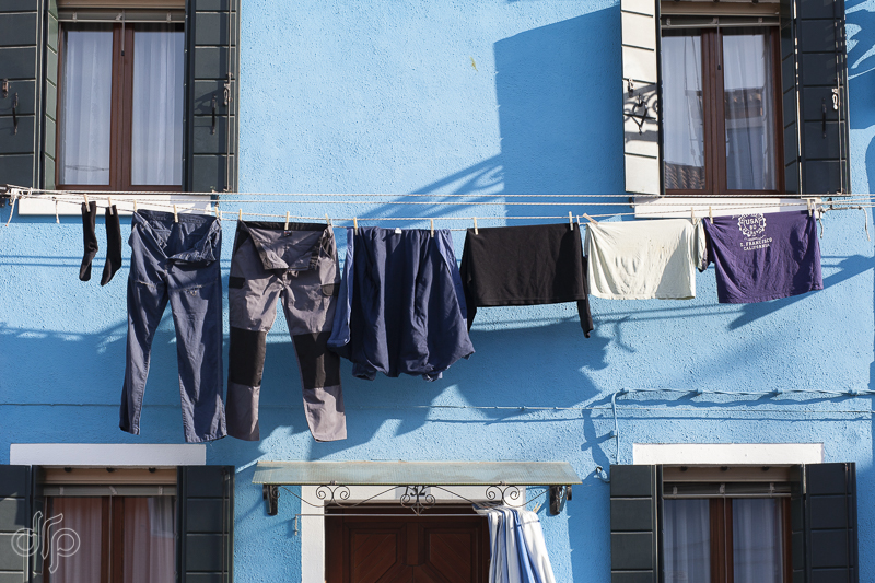 blue laundry at blue house in Burano, Italy