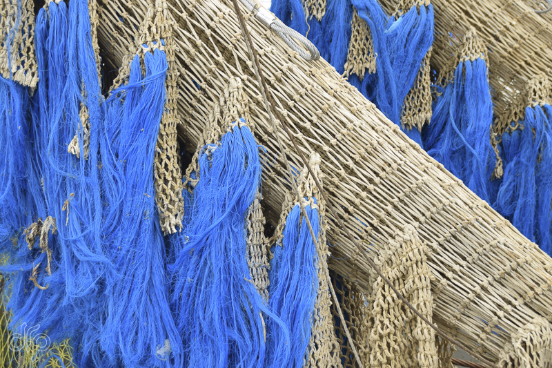 large fishing nets with blue ropes