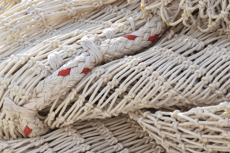 Folded fishing nets with red details