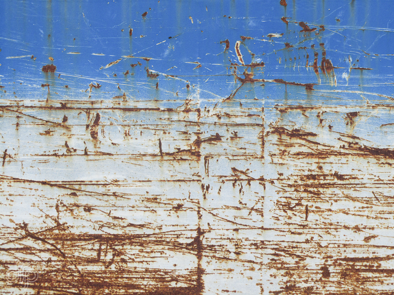 rusty scratches on blue suface