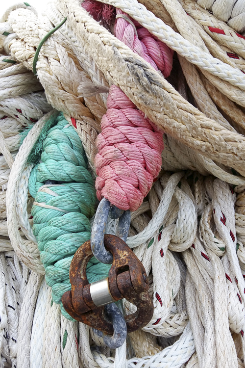 green and pink rope with rusty lock