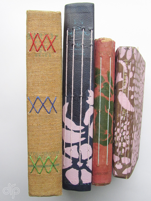 Four rebound journals with different bindings