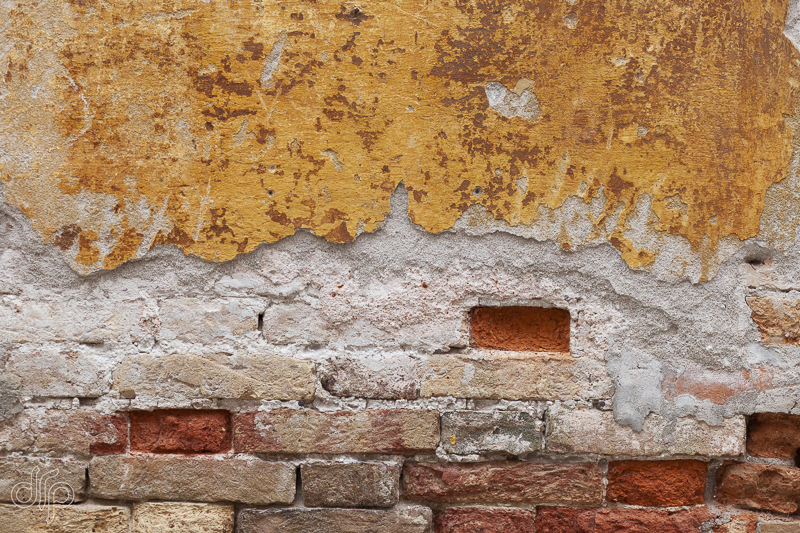 Indian-yellow-and-rusty-coloured-textured-wall-Venice-Italy.jpg