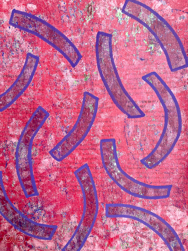 Gelli plate pattern with red background and blue shapes
